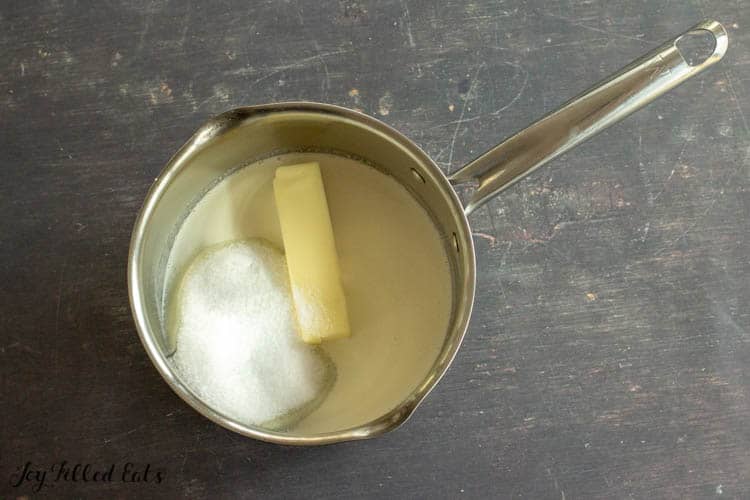 saucepan containing stick of butter and sweetener