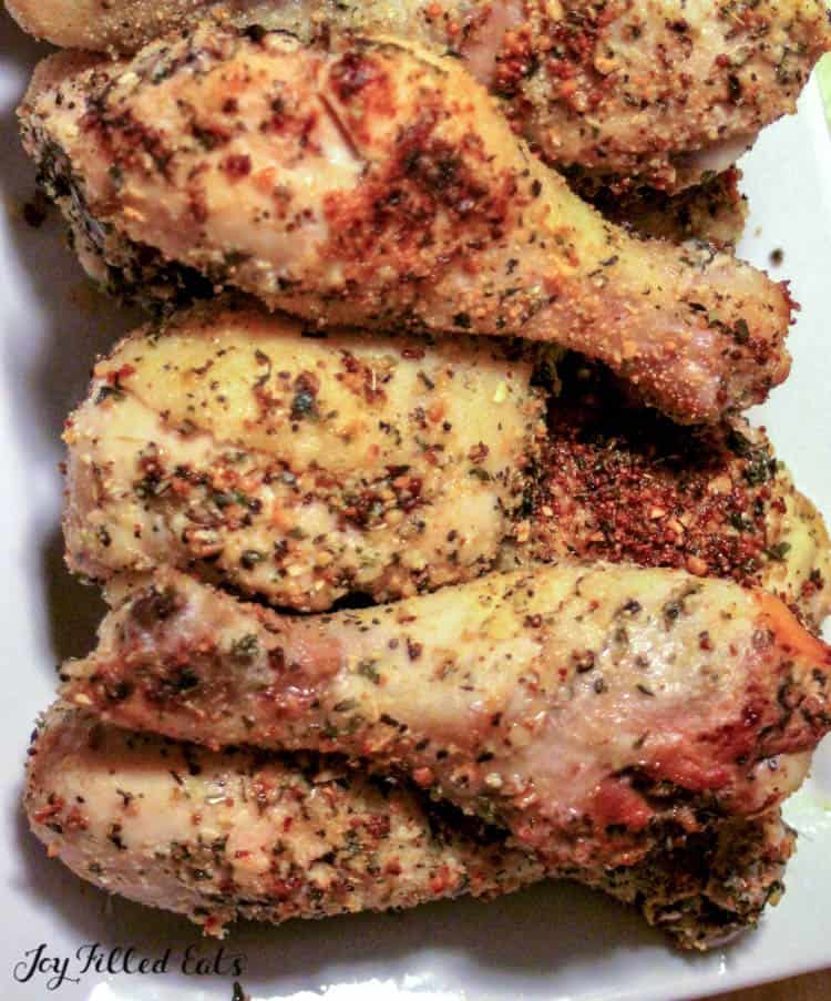Pile of Parmesan crusted baked chicken legs close up