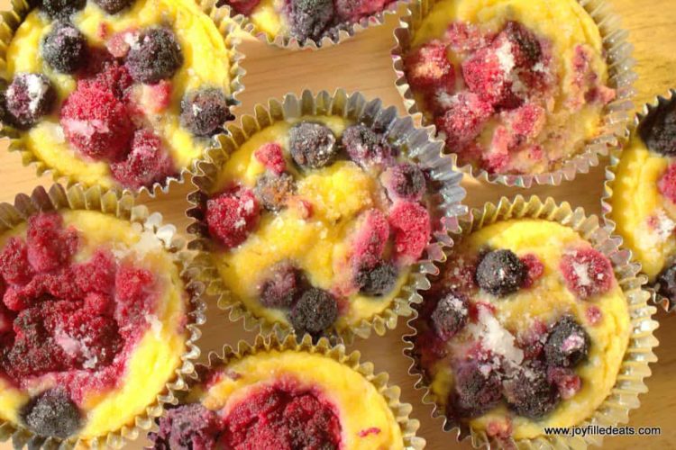 overhead view of lemon muffins with berries up close