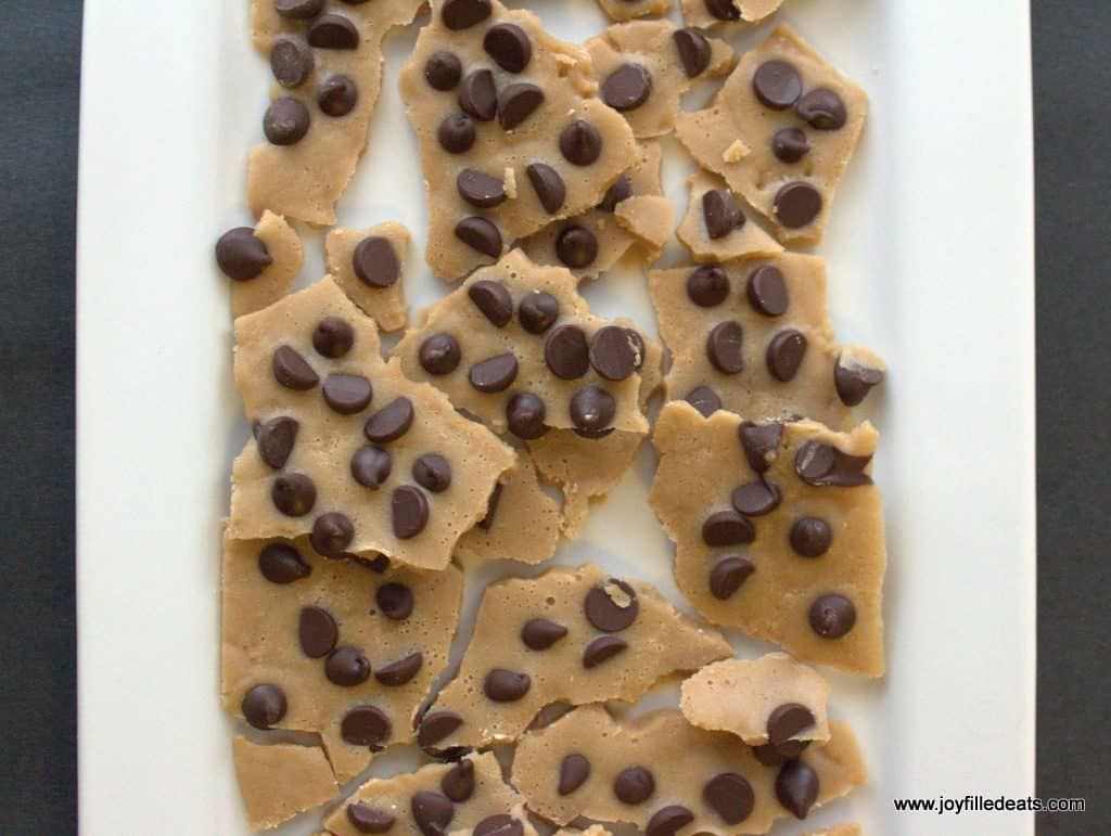 overhead view of low carb chocolate chip cookie dough bark placed on a white platter