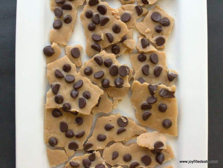overhead view of low carb chocolate chip cookie dough bark placed on a white platter