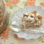 serving of chocolate chip cookie trifle on a white plate with spoon
