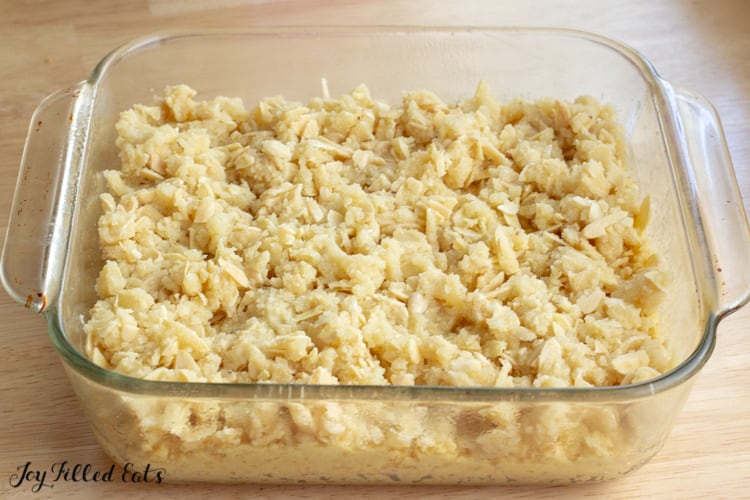 unbaked Almond Crumb Cake in a glass pyrex