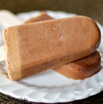overhead view of two sugar free mocha fudgesicles leaning on each other on a white plate