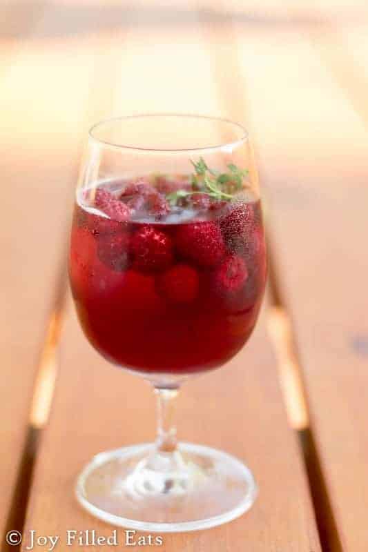 small wine glass filled with keto raspberry sangria