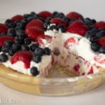 glass pie plate with low carb berries & cream ice cream pie with slice missing