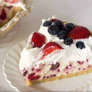 slice of ice cream pie topped with mixed berries