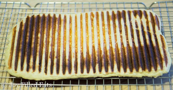 grilled low carb panini dough on a cooling rack