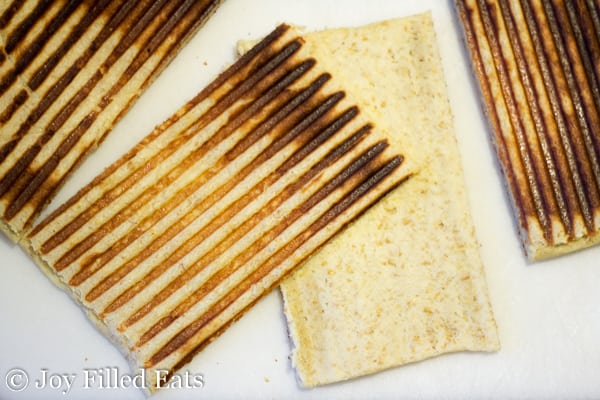 pieces of grilled low carb panini dough from above