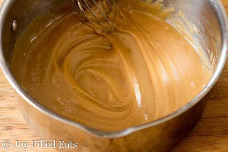 caramel icing in a large mixing bowl