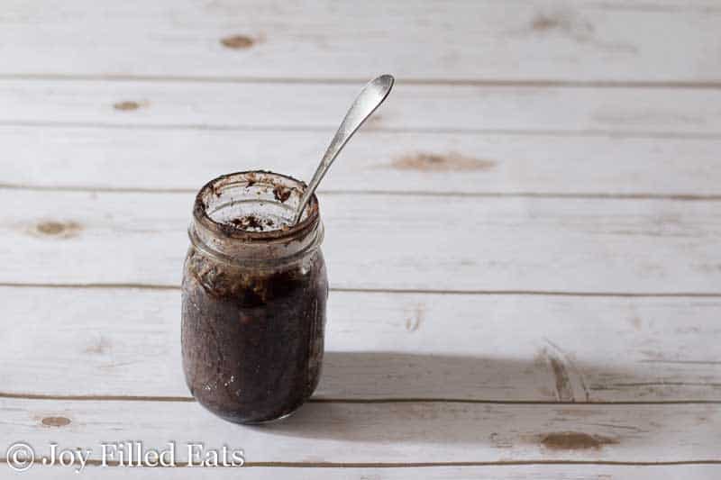 fork sticking in a mason jar full of a chocolate pecan mason jar