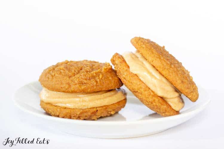 plate of two peanut butter whoopie pies leaning on each other