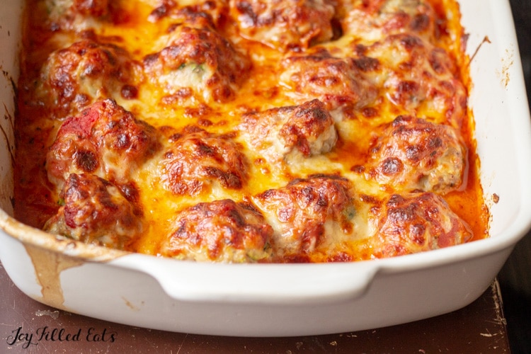 close up of the keto meatball casserole in a baking dish