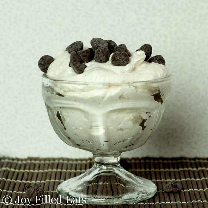 small ice cream bowl full of whipped cannoli mousse topped with chocolate chips