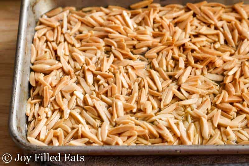 toasted almond slivers in a baking dish