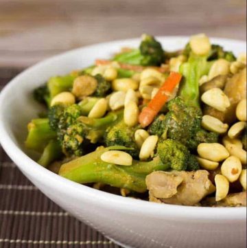 close up on bowl of thai peanut chicken and broccoli