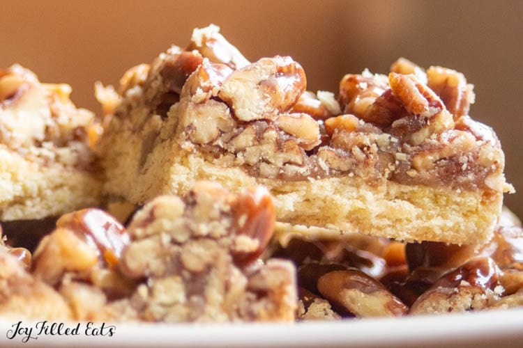 close up on pecan praline cookie bars showing layers in cookie
