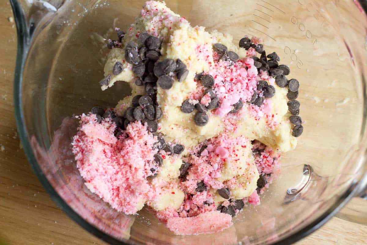 glass mixing bowl full of peppermint fudge sandwich cookie dough from above