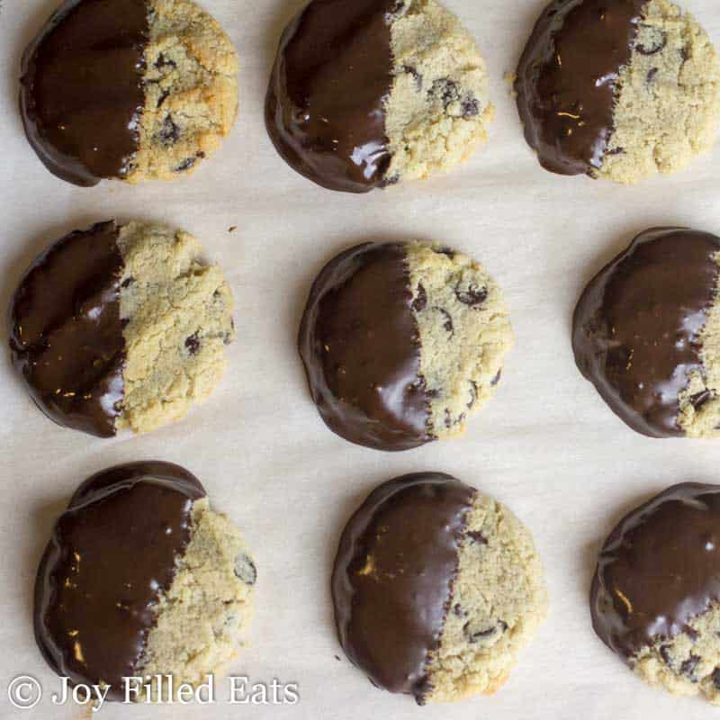 close up on chocolate chip shortbread cookies freshly dipped in melted chocolate from above