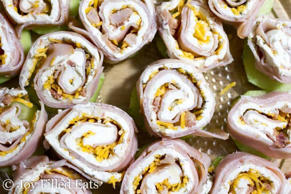 overhead view of turkey bacon ranch pinwheels on a plate close up