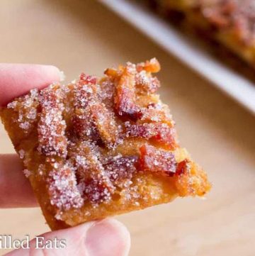 hand holding square of low carb maple bacon crack