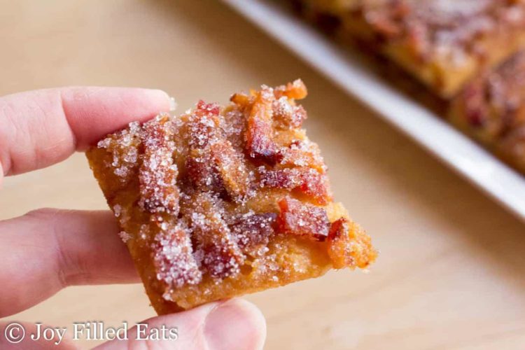 hand holding square of low carb maple bacon crack