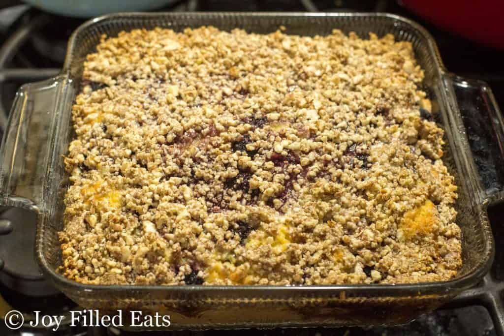 baked blackberry coffee cake in a square baking dish