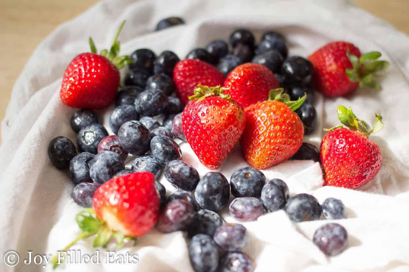 pile of fresh blueberries and strawberries