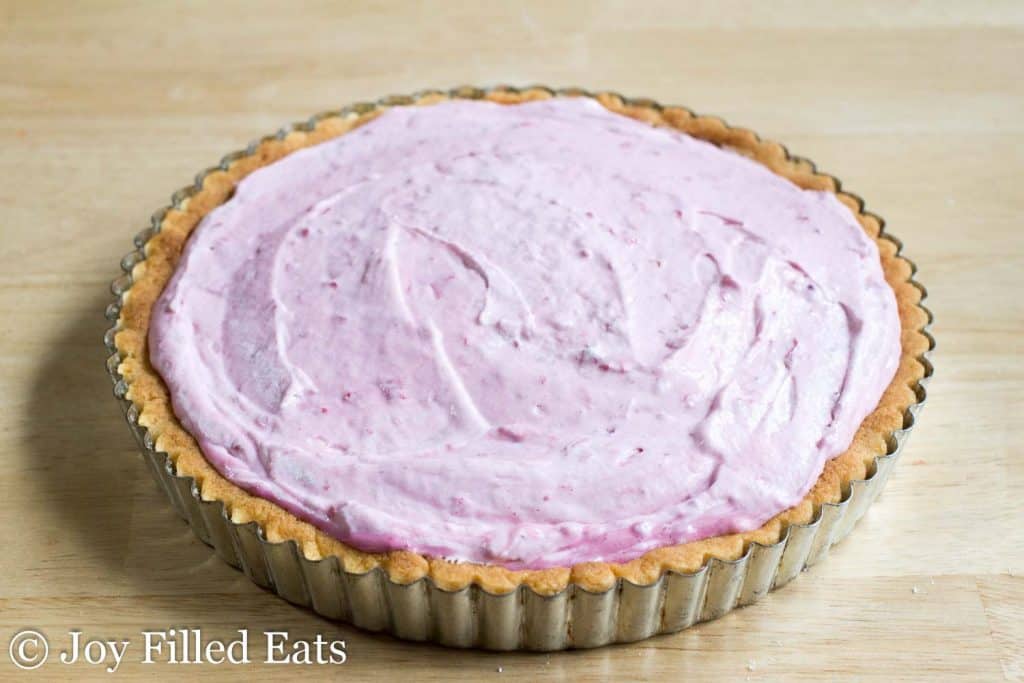 pie plate filled with raspberry mousse tart