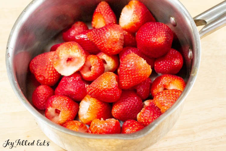 Pot of hulled strawberries