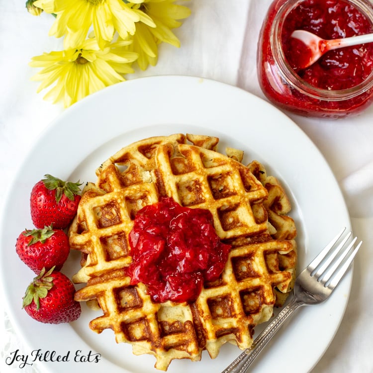 Waffle topped with keto Strawberry Jam on a white plate