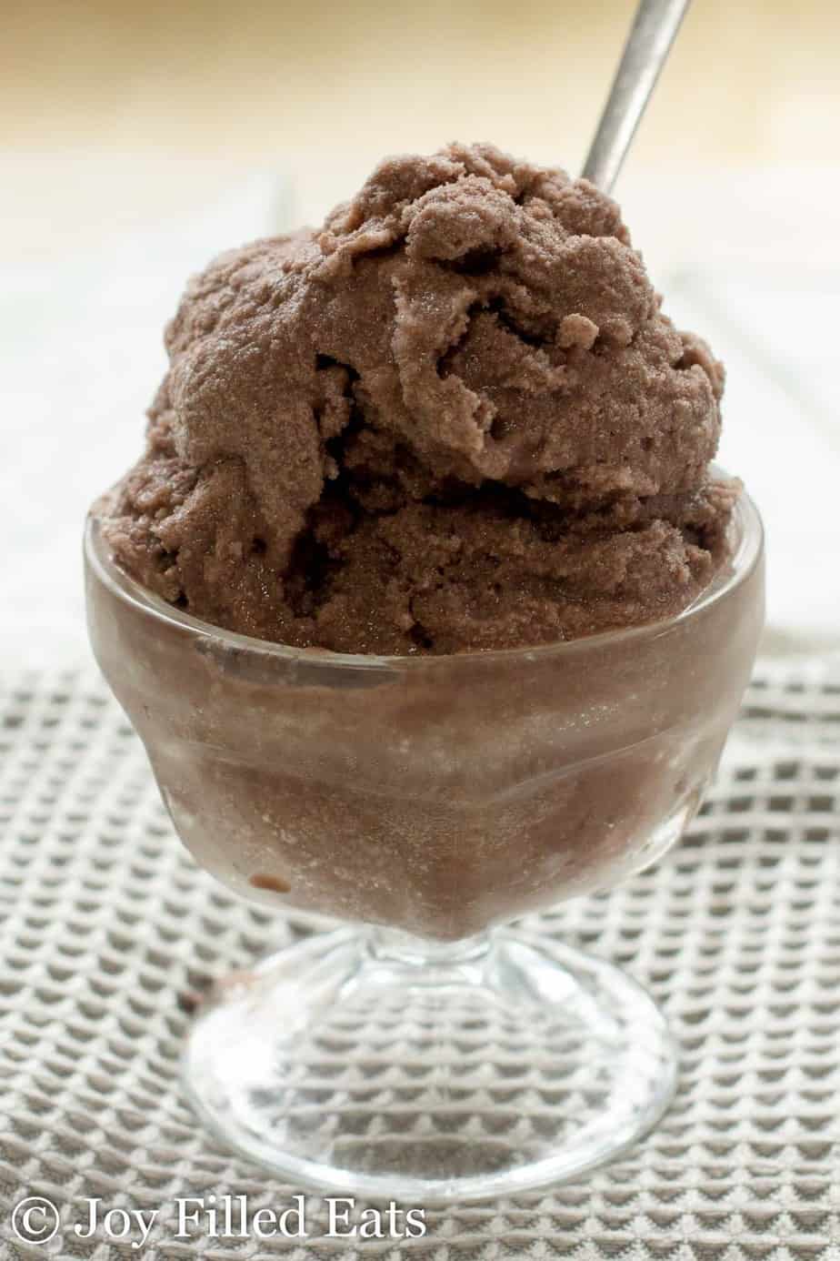 close up on scoop of chocolate cream Italian ice in a small glass ice cream bowl