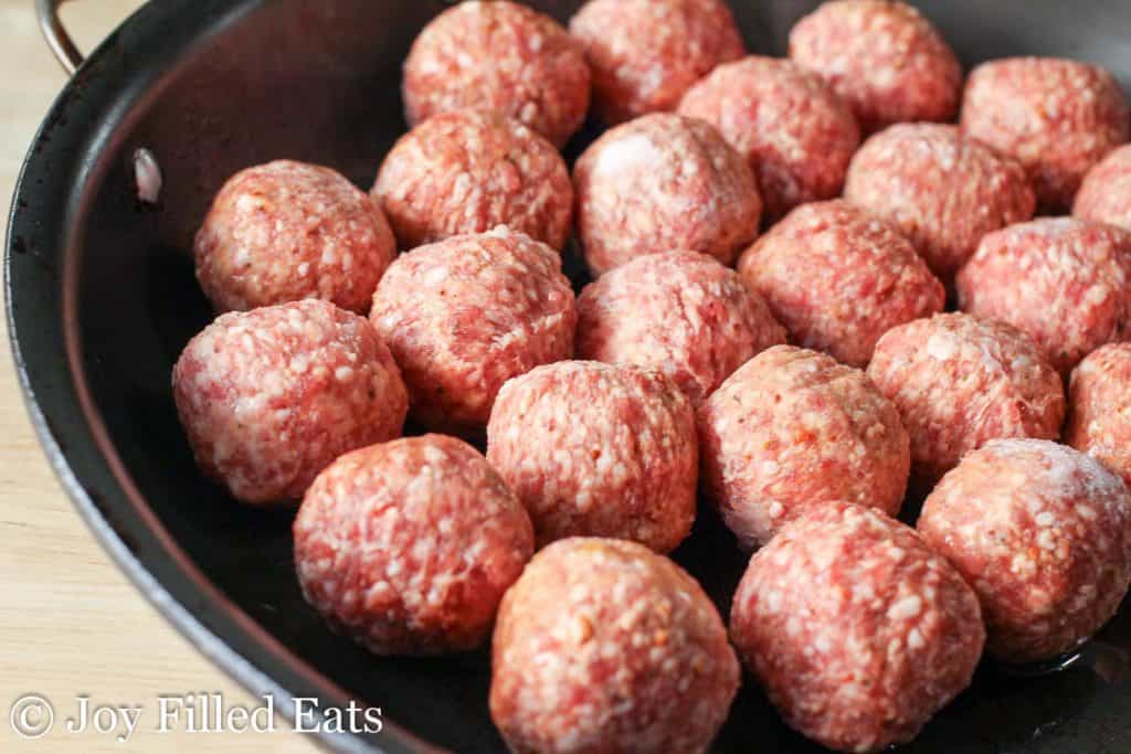 meatballs in a skillet to be cooked