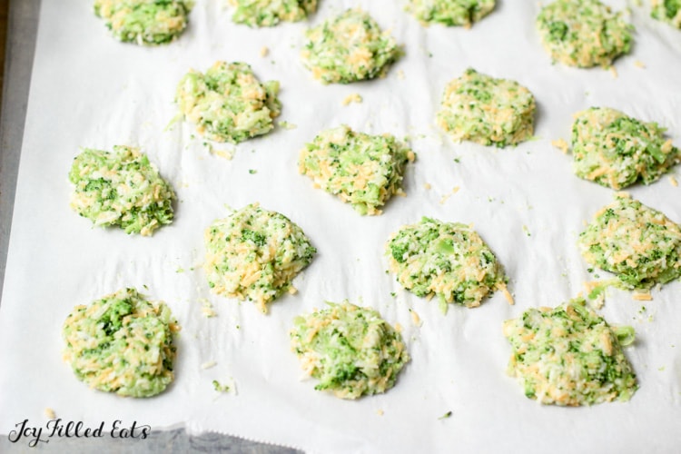 Broccoli Cheese Nuggets shaped onto parchment paper