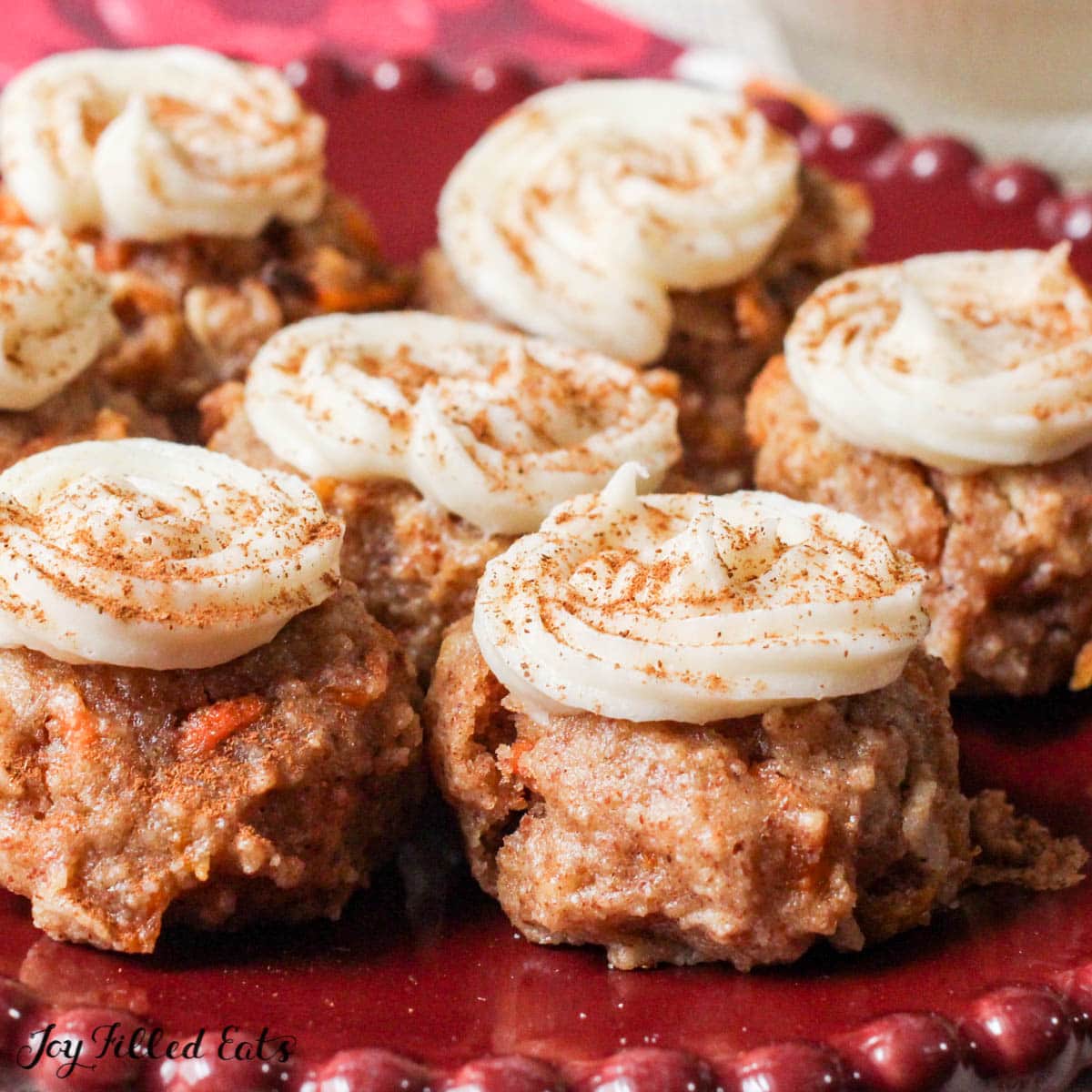 Mini Carrot Cake Cookies with Cream Cheese Frosting on a red plate