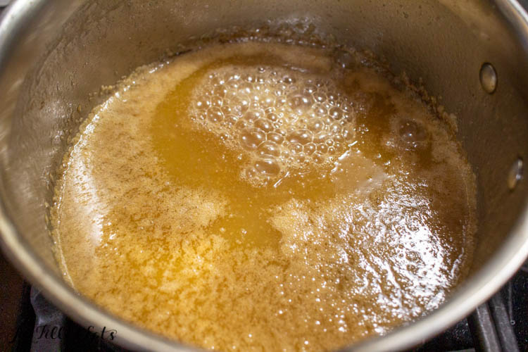 bubbling caramel close up in a sauce pan