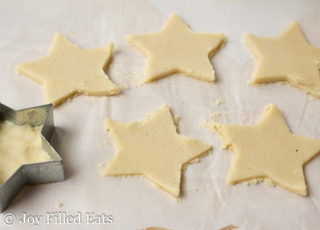 star shaped keto vanilla cookie dough lined on parchment paper