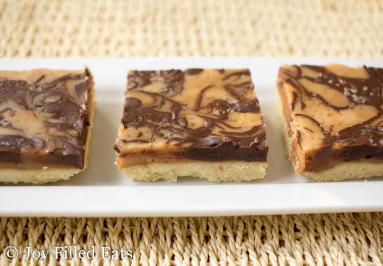 salted caramel shortbread squares lined on a platter