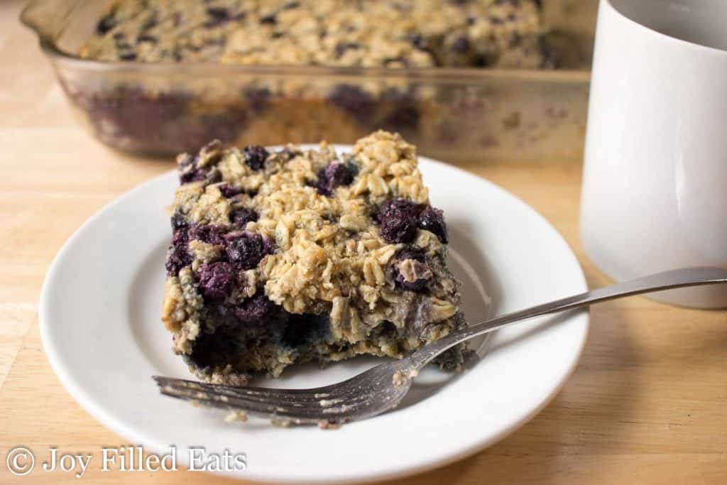 Close up of Healthy Baked Oatmeal on a white plate with a fork