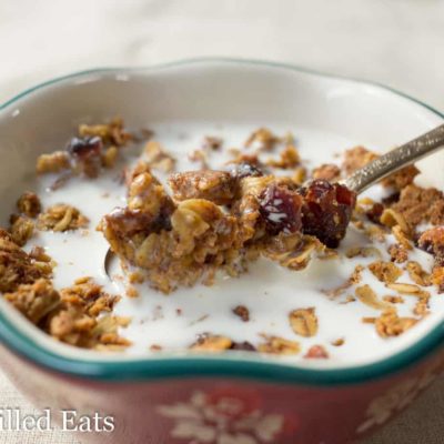 bowl of granola and type of milk with spoon