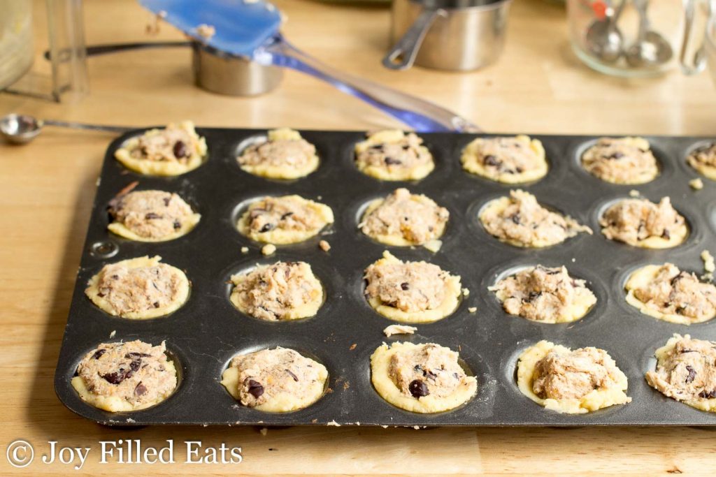 mini muffin tin full of southwest chicken appetizer bites before being baked