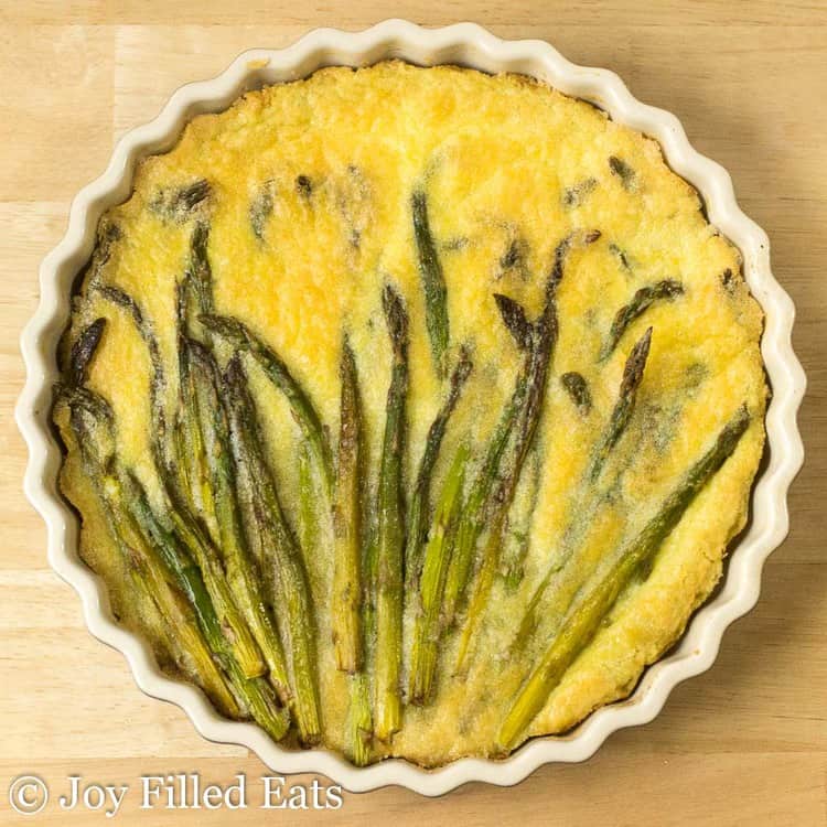 overhead view of asparagus quiche in pie plate