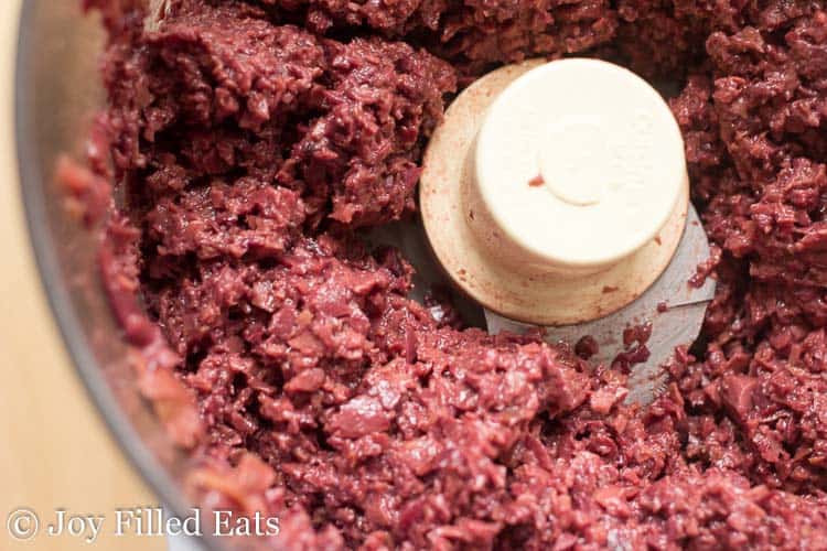 food processor full of olive tapenade close up