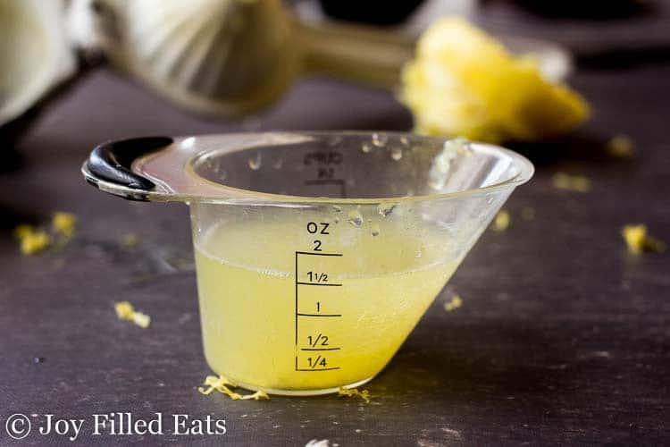 lemon juice in a measuring cup