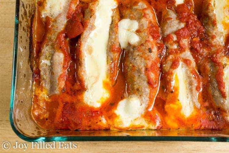 close up on casserole dish filled with stuffed sausage from above