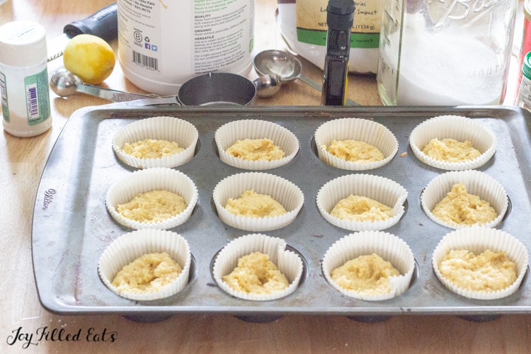  batter spooned into wrappers in a muffin tin