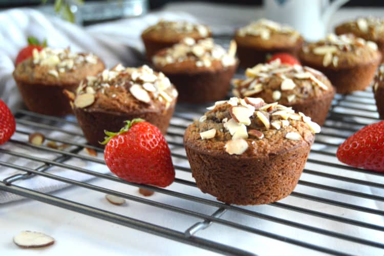 Strawberry Almond Flour Muffins on a cooling rack with whole berries