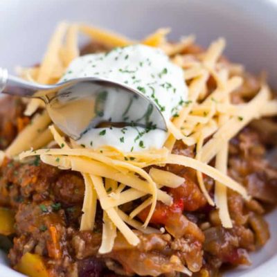 spoon dipping into bowl of slow cooker no bean chili