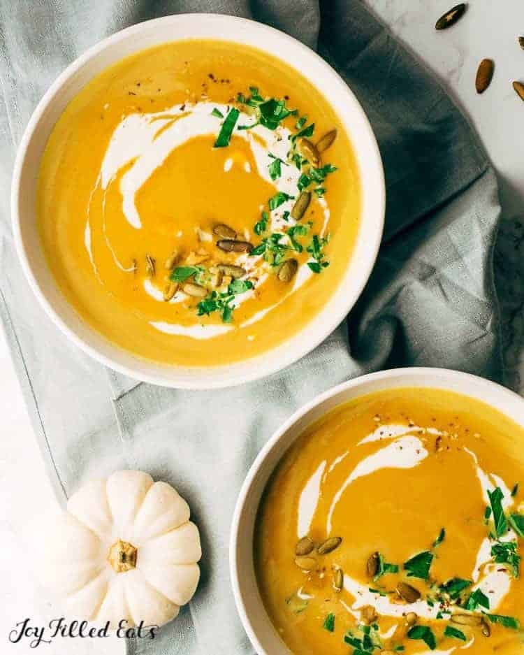 two bowls of pumpkin soup from above