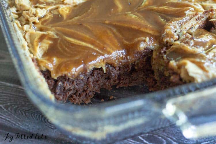 close up of caramel macchiato brownie in baking dish with corner piece missing
